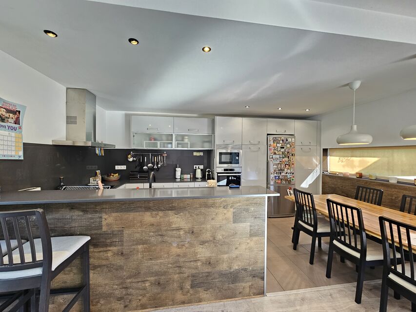 Modern ground floor villa with patio and pool